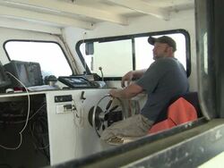 Fisherman pilots his boat into the Chesapeake Bay Stock Footage