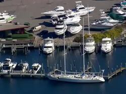 WS AERIAL Traffic moving on bridge over river at Mystic / Connecticut, United States Stock Footage