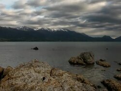 Snow capped Mountain Lake Time Lapse Stock Footage