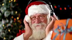 Santa Claus listening music Stock Footage