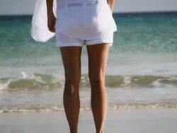 Woman stretching on beach Stock Footage