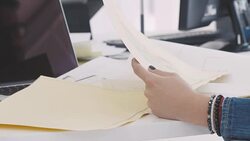 Businessman and businesswoman discussing about blueprints Stock Footage