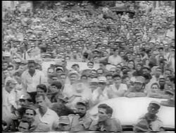 B/W 1959 crowd of people outdoors / some clapping / post-revolution Havana / newsreel Stock Footage