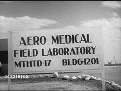 1953: VIKING ROCKET PROJECT: CU Project manager Milton Rosen, SOT saying engineering problems for manned space flight staggering. HOLLOMAN AIR FORCE BASE: 'Aero Medical, MTHTD-17, Bldg-1201' sign on field, VS White mice test subjects, camera installe Instructional Video