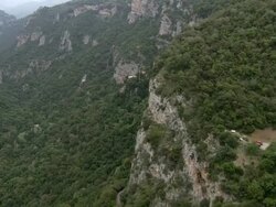 WS AERIAL Two monasteries on Side of mountain above Lousios river  / Lousios river,  Peloponissos, Greece Stock Footage