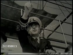 1937: JAPANESE AGGRESSION: TU WS Biplane in flight. WS USS Panay patrol boat on Yangtze River. TU MS Lieutenant Commander J.J. Hughes (not confirmed) pointing, biplane aircraft diving, gunners behind ship artillery. WS USS Panay taking on water. Instructional Video