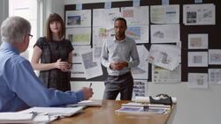 MS Mature businessman leading discussion with coworkers in office conference room Stock Footage