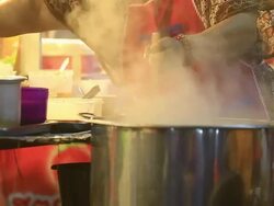 Woman cooking noodle Stock Footage