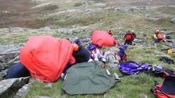 Langdale/Ambleside Mountain Rescue Team members doing first aid training using members of the casualties union, Ambleside, Lake District, UK. Stock Footage