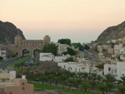 WS PAN DS view of city gates and urban area / Muscat, Oman Stock Footage