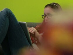 Teenage girl playing with digital tablet Stock Footage