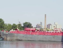 WS PAN View of boat moving from under Barge & Manhattan Bridge / New York, United States Stock Footage