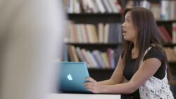 Students leaving class as teacher talks to a girl still in classroom. Stock Footage
