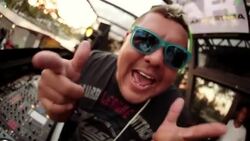 DJ at exclusive club rocks out for camera and makes heart with hands Stock Footage