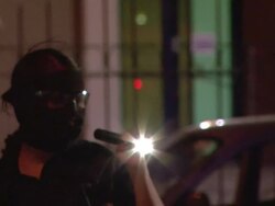 MS Shot of Police in mask on streets with torch AUDIO / Ciudad Juarez, Juarez, Mexico Stock Footage