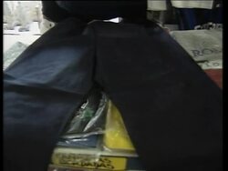 Traders sell paper clothes to tourists News Clip