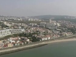AERIAL WS Coastline with cityscape / Oeiras, Lisbon, Portugal Stock Footage