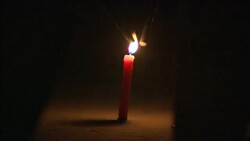 Diwali participants light sparklers from the flame of a taper. Stock Footage