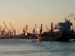 WS View of shipyard and ship floating in river with small boat / Hamburg, Hamburg, Germany Stock Footage