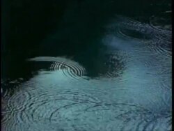 CU sky reflected in lakes rippling surface, Uganda, Africa Stock Footage