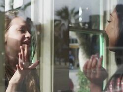 Girlfriends inside coffee shop, view from inside. Stock Footage