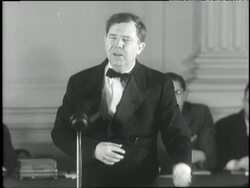 A cork pops from a bottle of champagne during U.S. Senator Huey Long's Share Our Wealth speech. News Clip