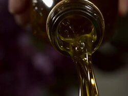 High speed oil pouring from bottle Stock Footage