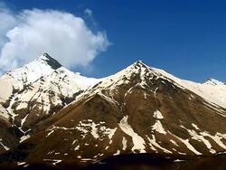 WS T/L Shot of Caucasus mountains and snowy peaks / Stepantsminda, Kazbegi, Georgia Stock Footage