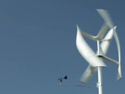 Vertical Axis Wind Turbine Spinning and Generating Electricity Stock Footage
