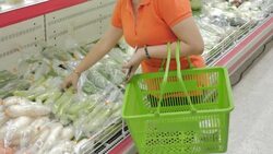 Women shopping fruits and vegetables in supermarket Stock Footage