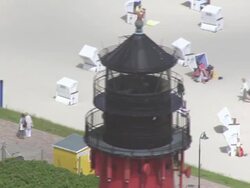 CU AERIAL DS ZO Shot of light house to coast of sylt island / Sylt, Schleswig Holstein Stock Footage