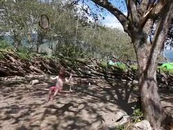 MS Little boy swings from tree in natural playgroun / Montezuma, Nicoya Peninsula, Costa Rica  Stock Footage