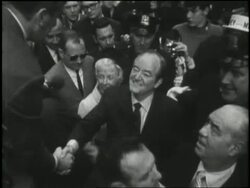 Democratic U.S. Vice-President Hubert Humphrey walks through a crowd of supporters with his wife Muriel, while campaigning in New York City in 1968. News Clip