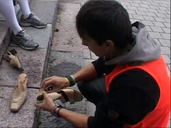 Men and women take part in race wearing high heels News Clip