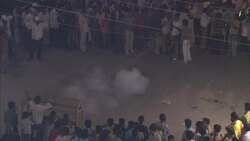 Spectators encircle fireworks exploding in the street for Diwali. Stock Footage