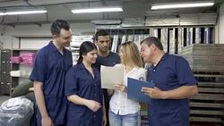 Fashion designer talking with the operators and giving instructions Stock Footage