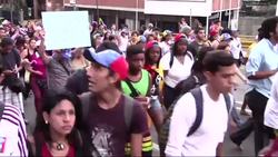 A so-called "barefoot march" took place on Wednesday in Venezuela's capital  against high inflation, shortages of basic goods and crime as the government and the opposition entered a second week of talks. News Clip