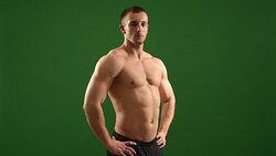 healthy athlete  with nice muscle on green  background Stock Footage