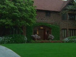 WS ZI View of brick tudor style and fraternity house and diamond paned windows then push in on door / California, United States Stock Footage