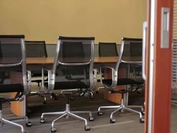MS PAN Shot of a modern cheirs in conference room from outside / Portland, Oregon, United States Stock Footage