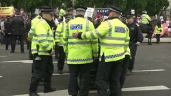 Police Officers Moving Anti-Austerity Protester News Clip