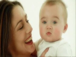 CU mother and baby playing on cushions Stock Footage