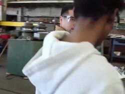 Workers talking together in factory warehouse Stock Footage