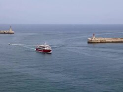 Valetta, view of ships entering the harbour in the city Stock Footage