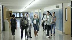 Young adult students bullying another student at school Stock Footage