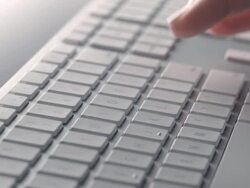CU R/F fingers type into number panel of computer keyboard and jump to main entry area of keyboard Stock Footage