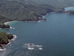 AERIAL View of coastline surrounded by ocean / Guanacaste, Costa Rica Stock Footage