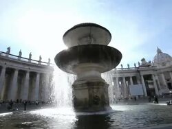 MS Fountain at St. Peter's Square with St. Peter's Basilica in background / Vatican City, Italy Stock Footage