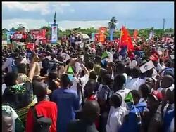 About 1,000 people cheered and marched with a team of 80 athletes and a cabinet minister who were participating in the Tanzania leg of the Olympic torch run. Officials have said that they do not expect any of the disruptions that have hit other torch runs in the world. News Clip