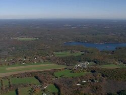 MS AERIAL View of New hampshire surrounded by fall in tree / Massachusetts, United States Stock Footage